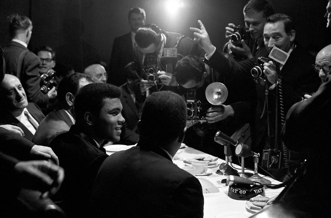 Photo of Ali doing a press conference